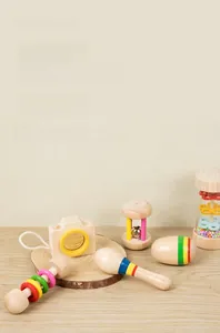 Detail of Montessori wooden baby rattle set for sensory and hand-eye coordination