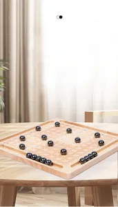 Macro shot of smooth black magnetic stone pieces on a square natural wooden game board