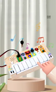 Detail of wooden sensory busy board with LED switches, piano keys, and electronic components