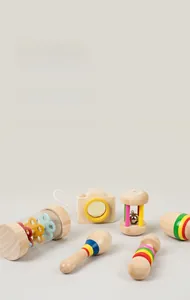 Detail of wooden sensory toys featuring colorful rattles and a mini camera for infant grip