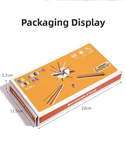 Close-up of sensory wooden stick balance game packaging with color dice and rings