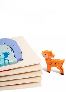 Detail of wooden animal puzzles for kids featuring layered elephant and deer designs