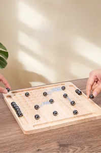 Detailed close-up of a magnetic chess battle game with wooden board and magnetic stone spheres