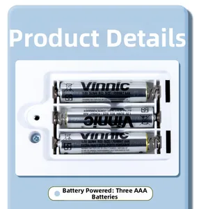 Close-up of the Montessori busy board battery compartment with three AAA batteries