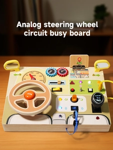 Close-up of wooden busy board featuring a steering wheel, gear shift, and LED light switches