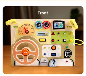 Close-up of wooden Montessori busy board with steering wheel, LED lights, and switches