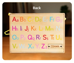 Detail of wooden alphabet puzzle board back with colorful letters and power compartment