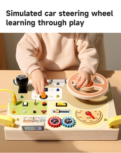 Close-up of wooden Montessori sensory board with simulated gear shift and steering wheel