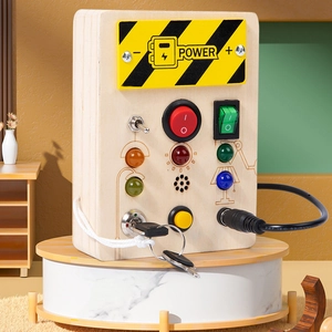 Montessori wooden busy board for kids featuring LED lights, switches and key lock puzzles