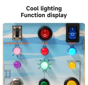 Detail view of wooden busy board featuring colorful LED lights and industrial switches