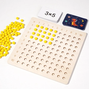 Montessori multiplication board game with wooden 10x10 hole board and yellow beads