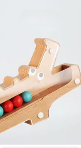 Detail of clear acrylic board on wooden crocodile puzzle toy with colorful beads
