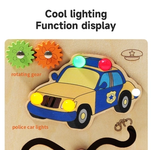 Detail of wooden busy board with rotating gears and interactive colorful LED police lights