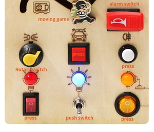 Detail of Montessori wooden busy board with colorful LED lights and mechanical switches