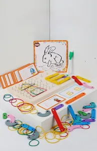 Detail of wooden geoboard with colored rubber bands and geometric blocks for kids