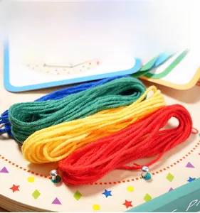 Detail of colorful soft yarn set for Montessori wooden threading and geometry pegboard toy