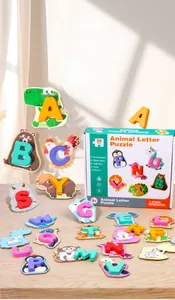 Detail of wooden alphabet animal matching puzzle pieces on a light tabletop