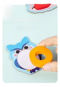 Detail of wooden alphabet puzzle with cartoon owl design and colorful stacking blocks