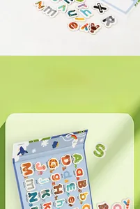 Close-up of wooden alphabet puzzle toys with cartoon animal shapes and matching letter slots