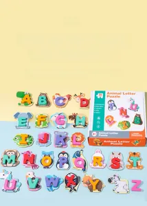 Close-up of 26 animal-themed wooden alphabet puzzle pieces with vibrant colorful gift box