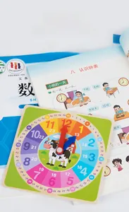 Macro shot of educational wooden clock with hour and minute markings and cartoon cow design