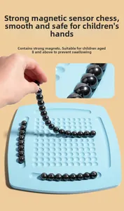 Detail of strong magnetic beads connected on a blue grid board for 2-in-1 strategy game
