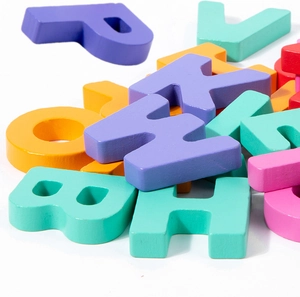 Close-up of colorful wooden alphabet blocks with smooth edges for early learning