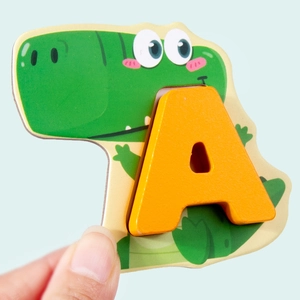 Educational wooden alphabet puzzle featuring a yellow letter A with a cartoon crocodile base