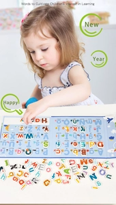 Close-up of child learning with colorful magnetic animal-themed alphabet letters on blue board
