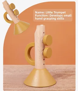 Detail of wooden trumpet toy showing easy-grip handle for infant fine motor skill training