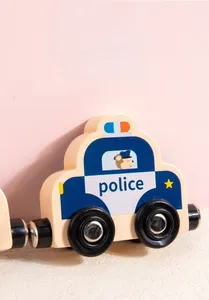 Detail of wooden police car toy train with heat transfer prints and magnetic connectors