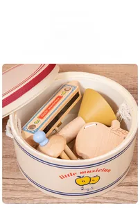 Detail of wooden musical toy set with drum, harmonica and rattles for sensory development