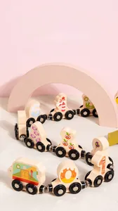 Close-up of wooden magnetic train cars with numbers and fruits in soft macaron colors