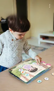 Detail of Montessori busy book with interactive body parts cards for early learning