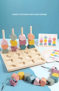 Macro view of wooden shape stacking board with colorful geometric blocks and lacing cord