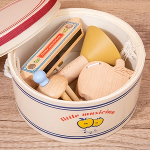 Wooden musical instrument set for toddlers with harmonica and handbell in a round gift box