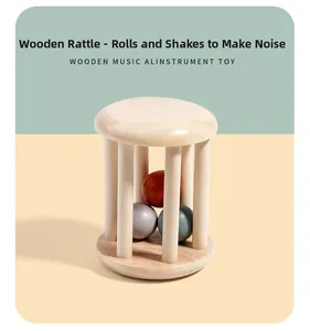 Detail of wooden cage bell rattle for babies featuring colorful interior spheres