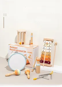 Close-up of wooden Orff musical instrument set in pastel colors and Montessori gift box