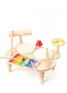 Close-up of bear-shaped wooden musical toy with xylophone, drums, and golden cymbal