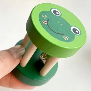 Baby wooden rattle with green frog cartoon and silver bell for sensory development
