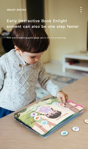 Toddler interacts with Montessori busy book focusing on body parts learning activities