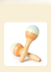 Detail of multi-colored wooden sand hammers with smooth beech wood handles for kids