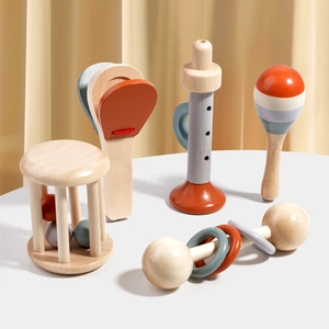 Morandi wood musical toy set with rattle and flute on a white background