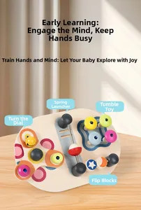 Close-up of wooden busy board featuring colorful spinning gears and spring levers