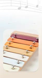 Detail of wooden xylophone for kids with colorful metal keys and natural wood base