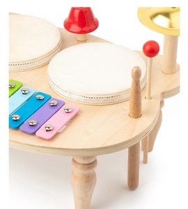 Macro detail of wooden musical toy featuring colorful xylophone keys and metal cymbals