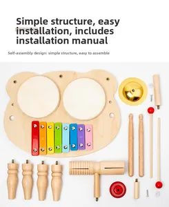 Flat lay of wooden musical toy parts including colorful xylophone keys and drum components