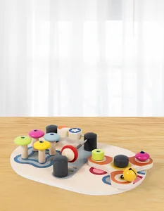 Close-up of wooden sensory busy board with colorful knobs and spring mechanisms for kids