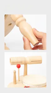 Close-up of smooth, rounded edges on a wooden percussion toy with a drumstick