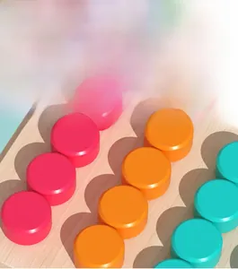 Close-up of smooth wooden logic board game featuring colorful round sliding pieces